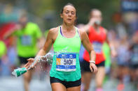 <p>A participant dumps her cup of water during the 2017 New York City Marathon, Nov. 5, 2017. (Photo: Gordon Donovan/Yahoo News) </p>