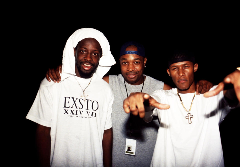 Rappers Wyclef (Nel Ust Wyclef Jean) of The Fugees, Chuck D. (Carlton Douglas Ridenhour) of Public Enemy and Canibus (Germaine Williams) poses for photos backstage after their performances at the International Amphitheatre in Chicago, Illinois in July 1998.