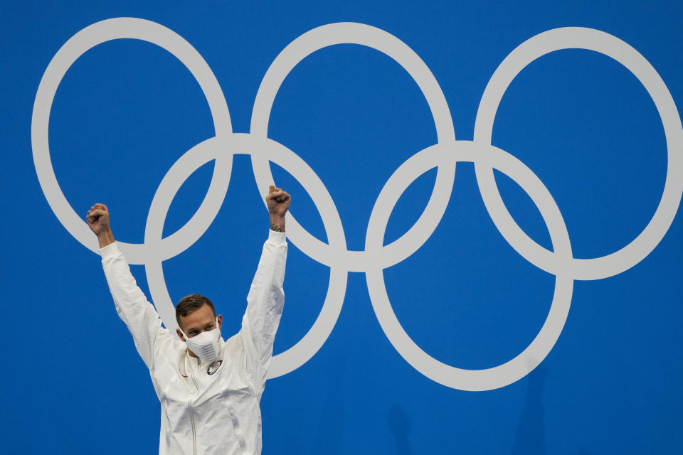 Caeleb Dressel, of the United States, celebrates his gold medal in the men's 4x100-meter medley relay final at the 2020 Summer Olympics, Sunday, Aug. 1, 2021, in Tokyo, Japan. (AP Photo/Jae C. Hong)