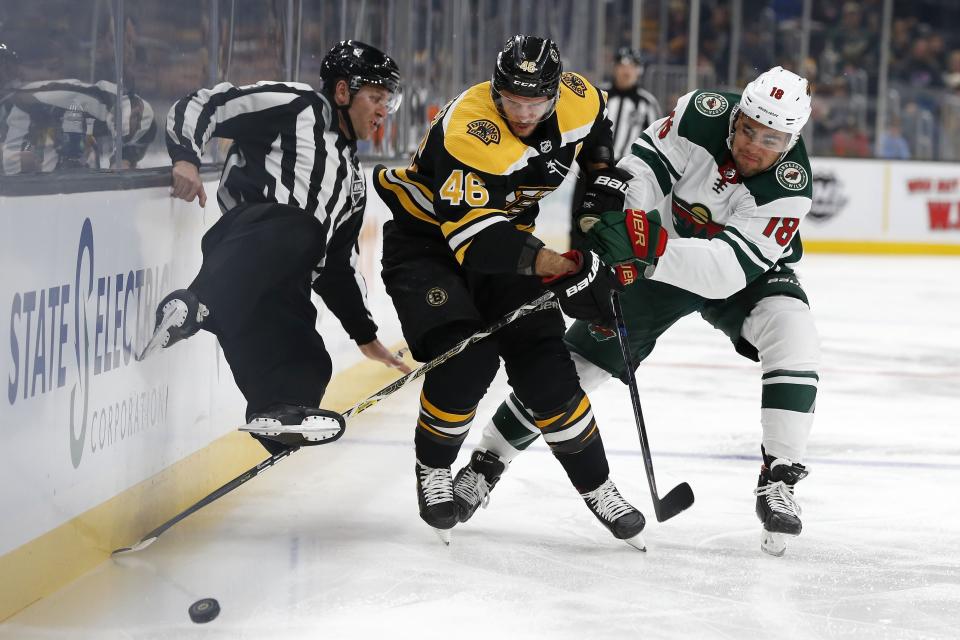 <p>
              Boston Bruins' David Krejci (46) and Minnesota Wild's Jordan Greenway (18) battle for the puck during the first period of an NHL hockey game in Boston, Saturday, Nov. 23, 2019. (AP Photo/Michael Dwyer)
            </p>