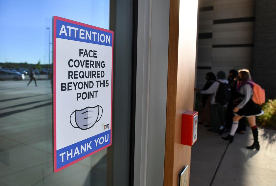 Signs highlight the mask policy during the first full day of school Thursday, Sept. 9, 2021, at Tech High School in St. Cloud.