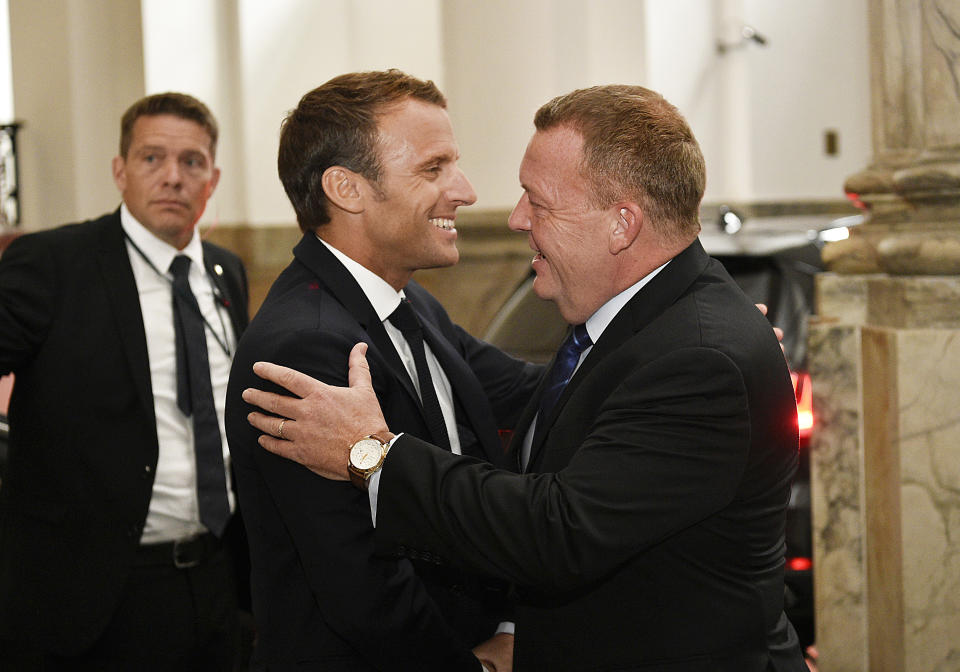 French President Emmanuel Macron meets with Danish Prime Minister Lars Loekke Rasmussen, right, at Christiansborg Castle in Copenhagen, Denmark, Tuesday Aug. 28, 2018. French President Emmanuel Macron is on a two-day visit, hoping to build the relationships he needs to push France's agenda of a more closely united European Union. (Nils Meilvang/Ritzau Scanpix via AP)