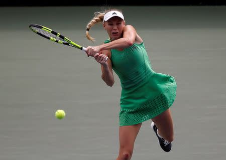 Tennis - Pan Pacific Open Women's Singles Final match - Ariake Coliseum, Tokyo, Japan - 25/09/16. Caroline Wozniacki of Denmark returns the ball against Naomi Osaka of Japan. REUTERS/Issei Kato