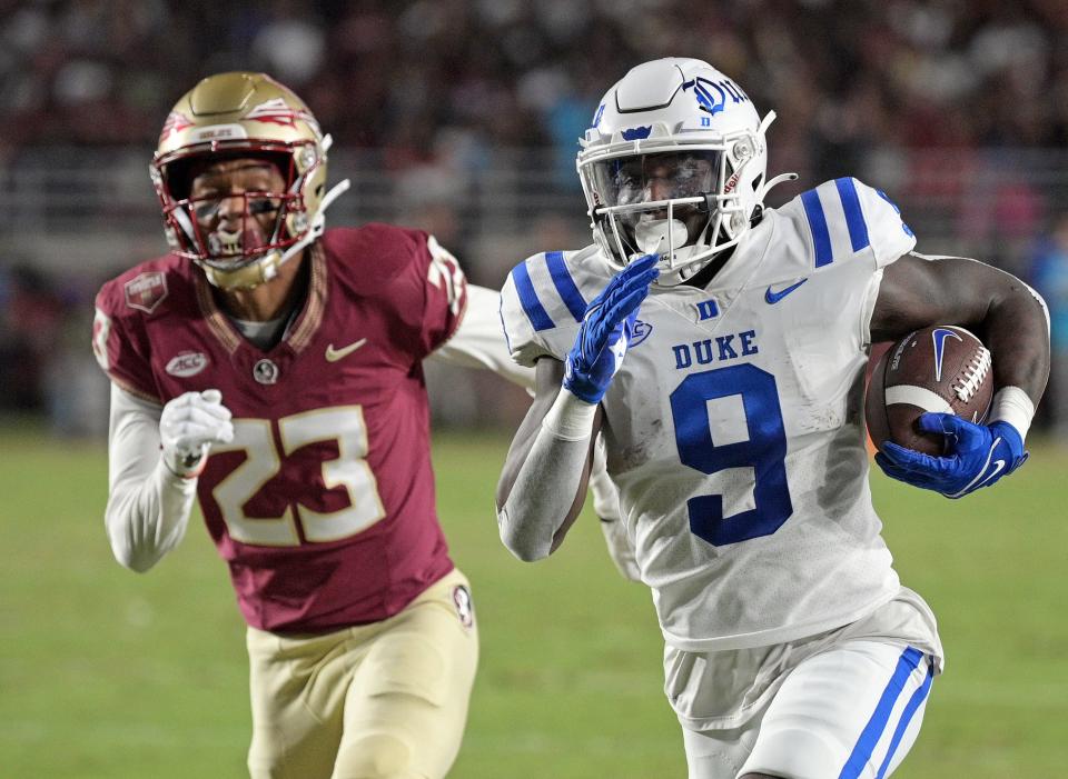 Oct 21, 2023; Tallahassee, Florida, USA; Duke Blue Devils running back Jaquez Moore (9) runs the ball past Florida State Seminoles defensive back Fentrell Cypress II (23) for a touchdown during the first quarter at Doak S. Campbell Stadium. Mandatory Credit: Melina Myers-USA TODAY Sports