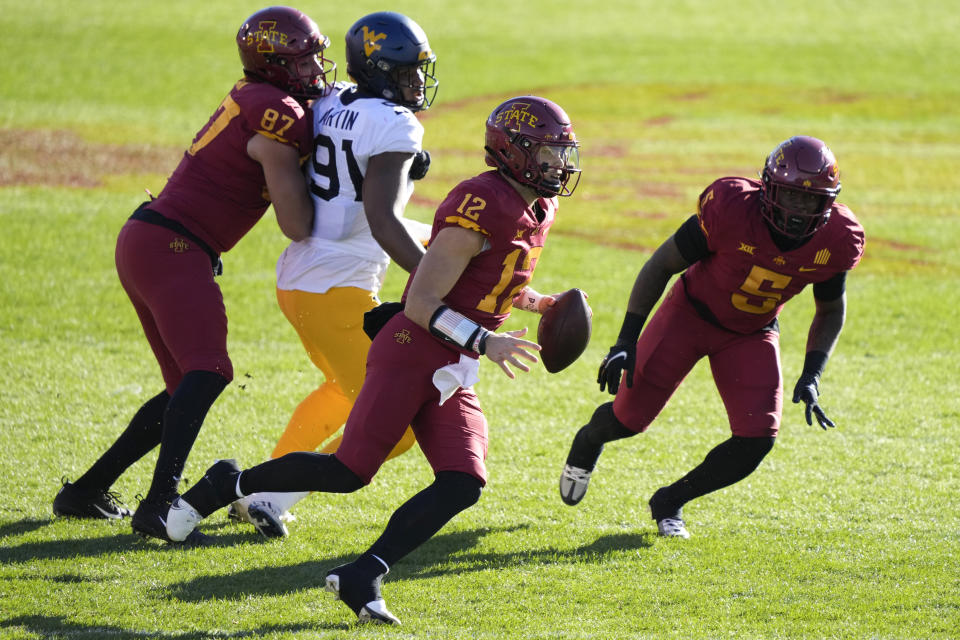 Iowa State quarterback Hunter Dekkers (12) looks to pass during the first half of an NCAA college football game against West Virginia, Saturday, Nov. 5, 2022, in Ames, Iowa. (AP Photo/Charlie Neibergall)