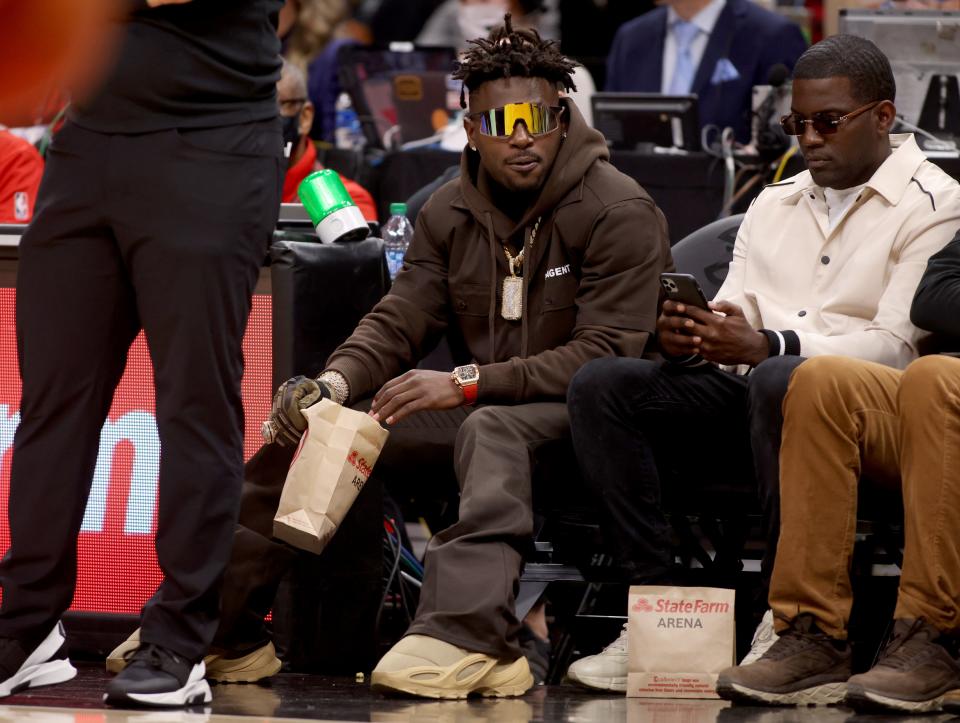 Former Tampa Bay Buccaneers wide receiver Antonio Brown watches the game between the Atlanta Hawks and the LA Clippers during the second quarter at State Farm Arena.