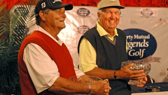 Jimmy Powell, left, and partner Al Geiberger hold their trophies after winning first place in the Liberty Mutual Legends of Golf Demaret Division at The Club at Savannah Harbor.