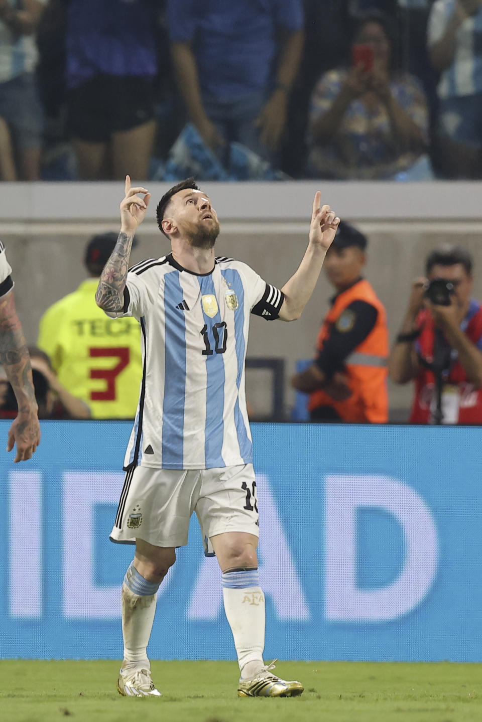 Argentina's Lionel Messi celebrates scoring the opening goal during an international friendly soccer match against Curacao in Santiago del Estero, Argentina, Tuesday, March 28, 2023. Messi scored his 100th goal with the national soccer team.