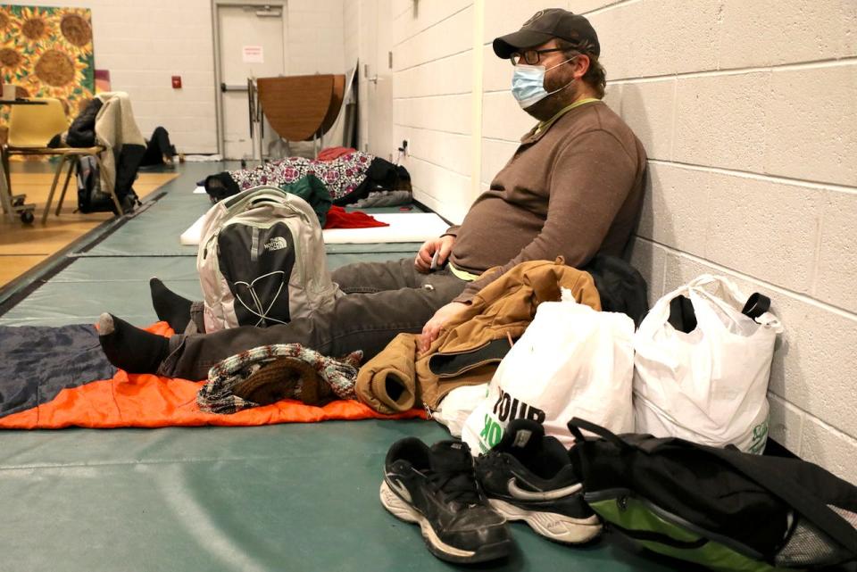 Nathan Frey of Rockford settles in for a night on Wednesday, Jan. 19, 2022, in the gymnasium of Second Congregational/First Presbyterian Church of Rockford. The church runs the Overnight Cafe in the gym during the winter months.