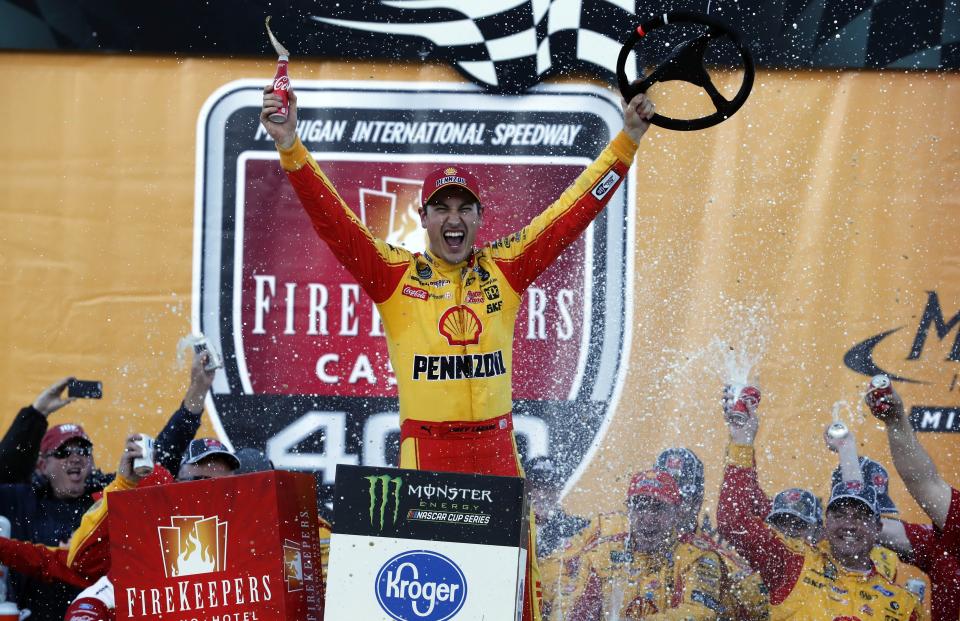 Joey Logano reacts after winning a NASCAR Cup Series auto race at Michigan International Speedway, Monday, June 10, 2019, in Brooklyn, Mich. (AP Photo/Carlos Osorio)