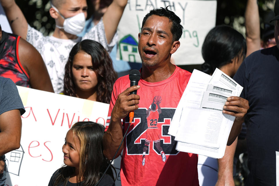 Resident Juan Carlos Jimenez speaks at a rally to address chronic problems in the apartment buildings Sept. 3, 2024, in Aurora, Colo.  (David Zalubowski / AP)