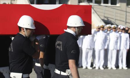 Turkish police officers carry a coffin holding the body of police officer Nedip Cengiz Eker during a funeral ceremony in Marmaris, Turkey, July 16, 2016. REUTERS/Kenan Gurbuz