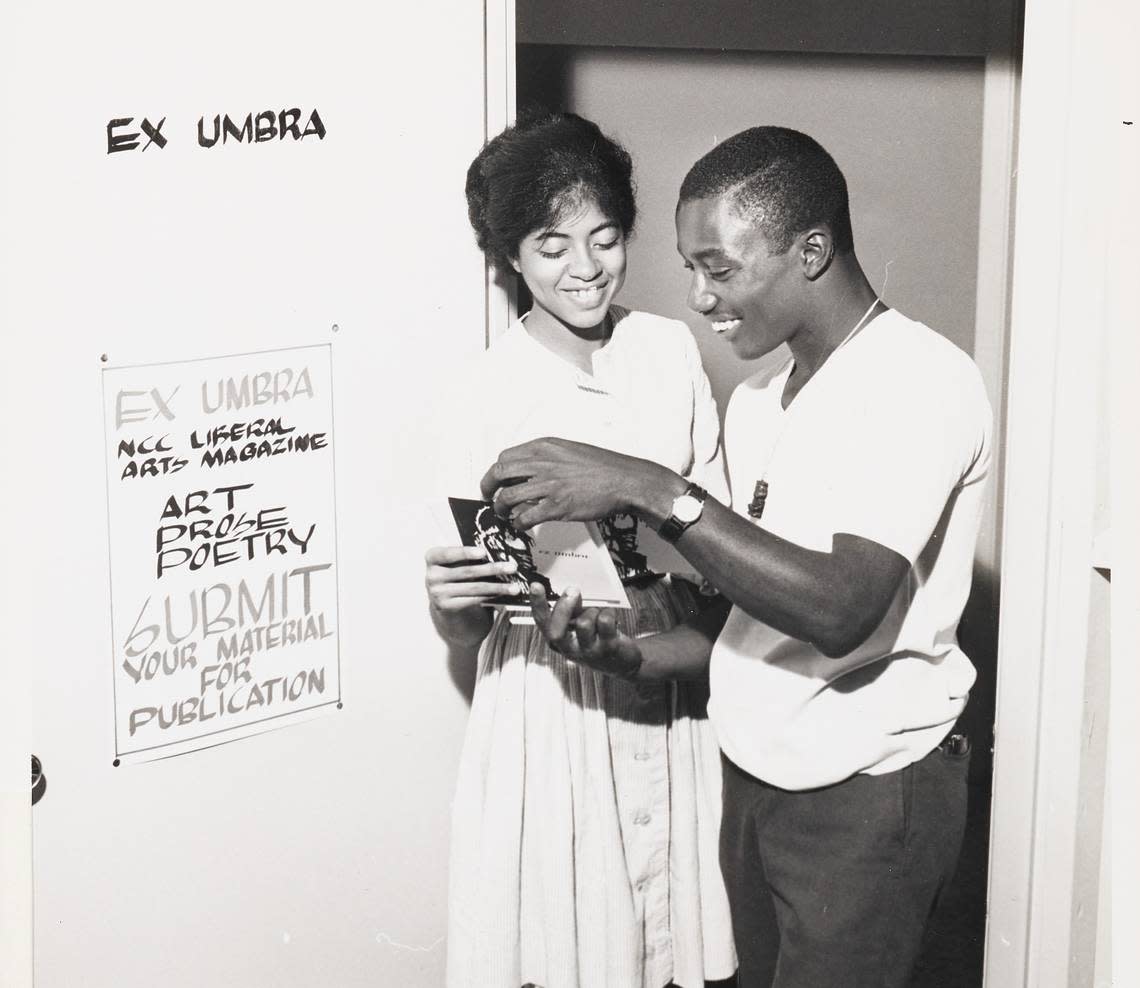 Sandra Page, a North Carolina College senior and prose editor of the college’s literary magazine, “Ex Umbra,” examines a copy of the last issue of the publication with Franklin Williams, a junior staff member, in the doorway of their new office in the campus student union building. The building, a converted dining hall, temporarily houses many of the college’s student organizations and some auxilliary enterprises. “Ex Umbra,” now in its third year, offers opportunities for creative expression in writing, art work, and photography for NCC students.