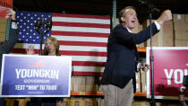 Republican gubernatorial candidate, Glen Youngkin and his wife, Suzanne greet the crowd as the arrive for an event in Richmond, Va., Tuesday, May 11, 2021. (AP Photo/Steve Helber)