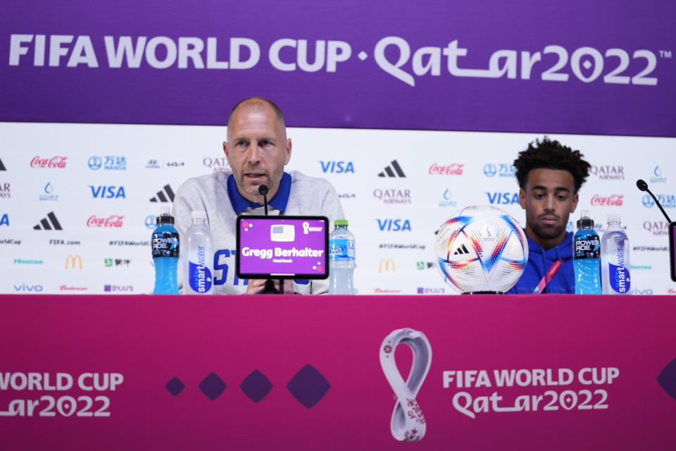 Head coach Gregg Berhalter, left, and Tyler Adams, both of the United States, attend a press conference on the eve of the group B World Cup soccer match between United States and Wales, at Ahmad bin Ali Stadium, in Doha, Qatar, Sunday, Nov. 20, 2022. (AP Photo/Ashley Landis)