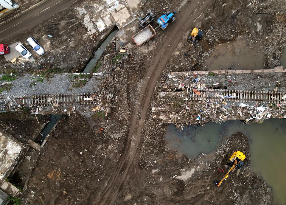 TOPSHOT - An aerial view taken on August 19, 2021 shows a destroyed railway track during clearing work in Altenahr, Rhineland-Palatinate, western Germany, weeks after heavy rain and floods caused major damage in the Ahr region. - Deadly floods in mid-July washed away homes, businesses and critical infrastructure, with the states of Rhineland-Palatinate and North Rhine-Westphalia worst hit. (Photo by Ina FASSBENDER / AFP) (Photo by INA FASSBENDER/AFP via Getty Images)