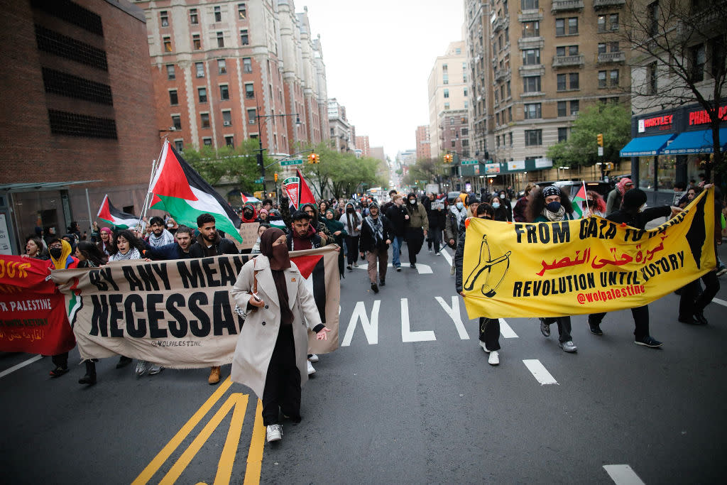 Pro-Palestinian protesters march outside Columbia University in New York City on April 18, 2024.