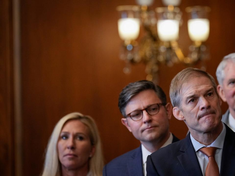 Johnson with Reps. Jim Jordan and Marjorie Taylor Greene at the Capitol on May 11, 2023.