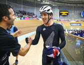 Shane Archbold of New Zealand, celebrates with his gold medal after the Men's 25km Scratch race.