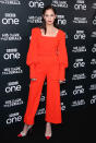 The former 'Luther' actress wears a red Emilia Wickstead jumpsuit, completed with oversized sleeves and a matching belt. <em>[Photo: Getty]</em>