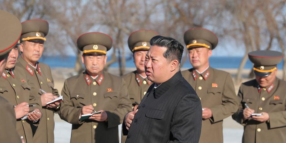 North Korean leader speaks to military officials during test-fire of new tactical guided weapon.