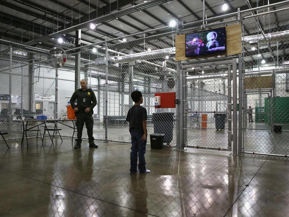 A boy from Honduras watches a movie at a detention facility run by the US Border Patrol (Getty Images/John Moore)