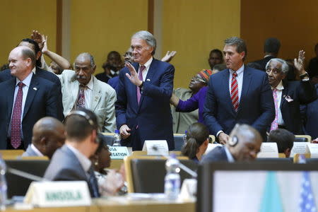 U.S. members of Congress Senator Chris Coons (D-DE) (L-R), Representative John Conyers (D-MI), Senator Ed Markey (D-MA), Senator Jeff Flake (R-AZ) and Representative Charlie Rangel (D-NY) stand as they are recognized during President Barack Obama's remarks at the African Union in Addis Ababa, Ethiopia July 28, 2015. REUTERS/Jonathan Ernst