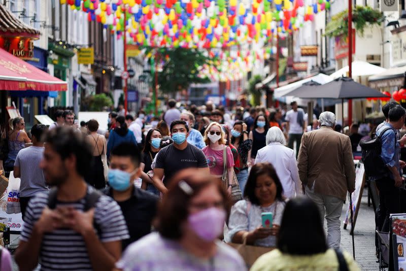 People walk through the Chinatown area, amid the coronavirus disease (COVID-19) outbreak, in London