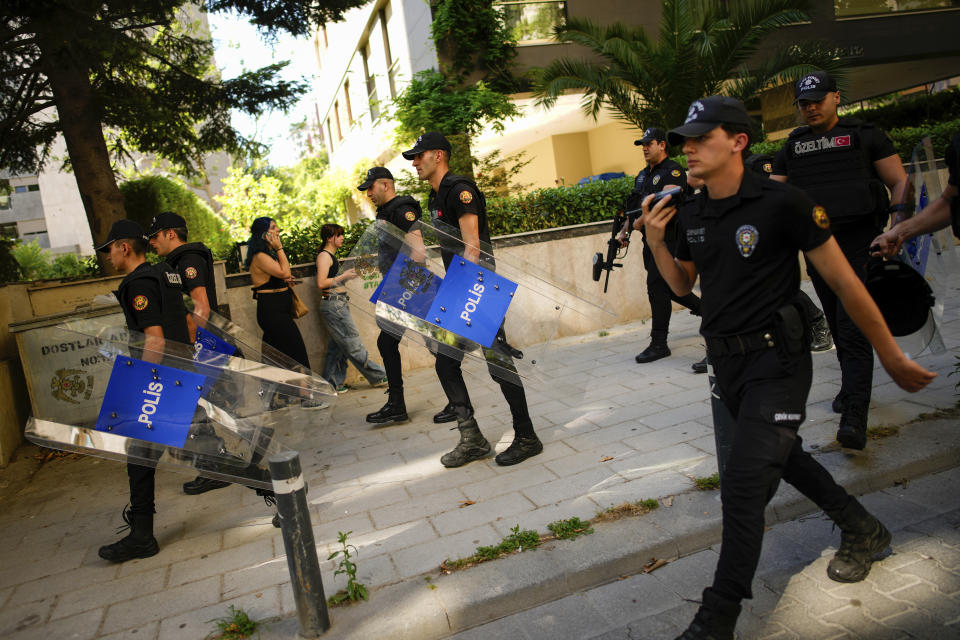 Police officers take positions during the annual LGBTQ+ Pride March in Istanbul, Turkey, Sunday, June 30, 2024. (AP Photo/Emrah Gurel)