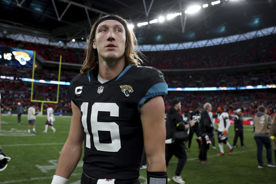 Jacksonville Jaguars quarterback Trevor Lawrence (16) leaves the pitch after the NFL football game between Denver Broncos and Jacksonville Jaguars at Wembley Stadium in London, Sunday, Oct. 30, 2022. Denver Broncos won by 21-17.(AP Photo/Ian Walton)