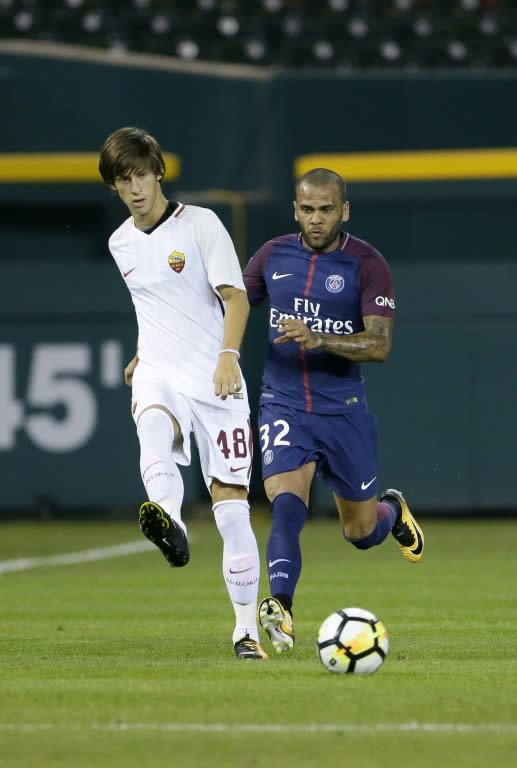 Dani Alves (R) of Paris Saint-Germain pursues Mirko Antonucci of AS Roma during the second half, at Comerica Park in Detroit, Michigan, on July 19, 2017