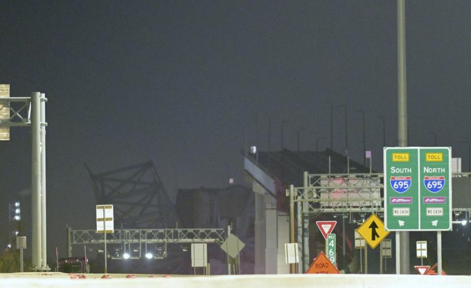 Parts of the Francis Scott Key Bridge remain after a container ship collided with a support Tuesday, March 26, 2024, in Baltimore. The major bridge in Baltimore snapped and collapsed after a container ship rammed into it early Tuesday, and several vehicles fell into the river below. Rescuers were searching for multiple people in the water. (AP Photo/Steve Ruark)