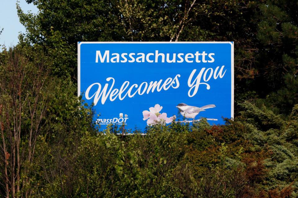 A "Massachusetts Welcomes You" sign at the Rhode Island / Massachusetts border on Route 95 South.