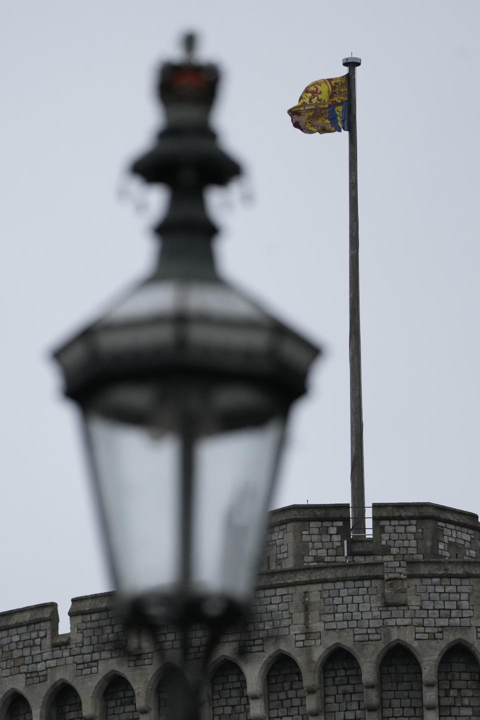 The Royal Standard flies above the round tower at Windsor castle at Windsor, England on Christmas Day, Saturday, Dec. 25, 2021. Britain's Queen Elizabeth II has stayed at Windsor Castle instead of spending Christmas at her Sandringham estate due to the ongoing COVID-19 pandemic. (AP Photo/Alastair Grant)