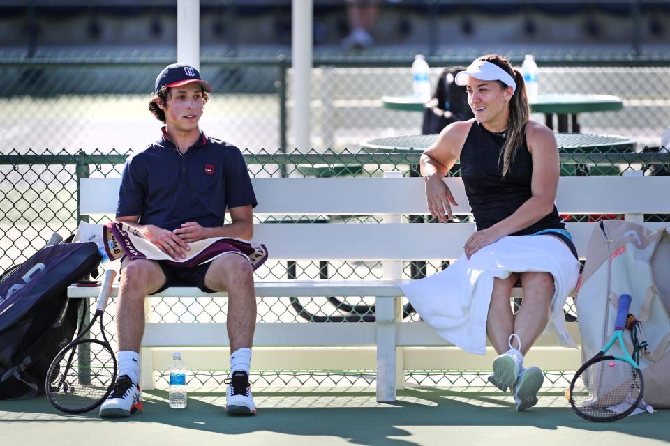 Palm Desert High School tennis player Eduardo Gonzalez chats with pro Danka Kovinic during the BNP Paribas Open at the Indian Wells Tennis Garden in Indian Wells, Calif., on Sunday, March 12, 2023.  