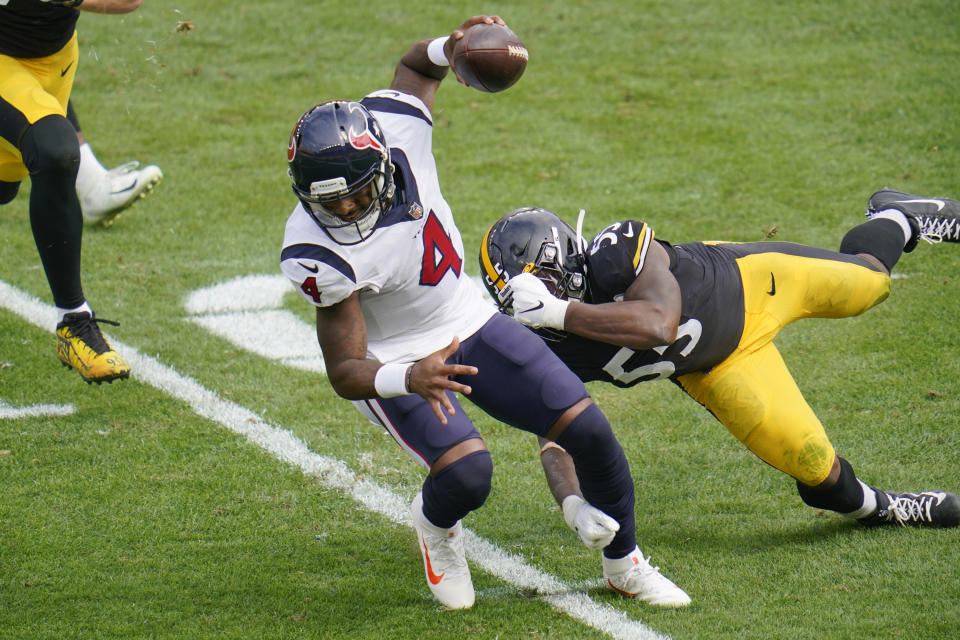 Houston Texans quarterback Deshaun Watson (4) tries to get past Pittsburgh Steelers inside linebacker Devin Bush (55) on a scramble during the first half of an NFL football game, Sunday, Sept. 27, 2020, in Pittsburgh. (AP Photo/Gene J. Puskar)