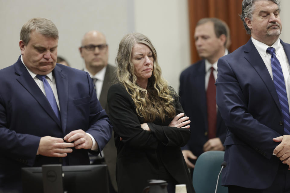 Lori Vallow Daybell stands and listens as the jury's verdict is read at the Ada County Courthouse in Boise, Idaho on Friday May 12, 2023. The Idaho jury convicted Daybell of murder in the deaths of her two youngest children and a romantic rival, a verdict that marks the end of a three-year investigation that included bizarre claims of zombie children, apocalyptic prophesies and illicit affairs. (AP Photo/Kyle Green)