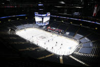 The Tampa Bay Lightning and the Columbus Blue Jackets play in an arena empty of fans during the first period of an NHL hockey game Thursday, Jan. 21, 2021, in Columbus, Ohio. (AP Photo/Jay LaPrete)