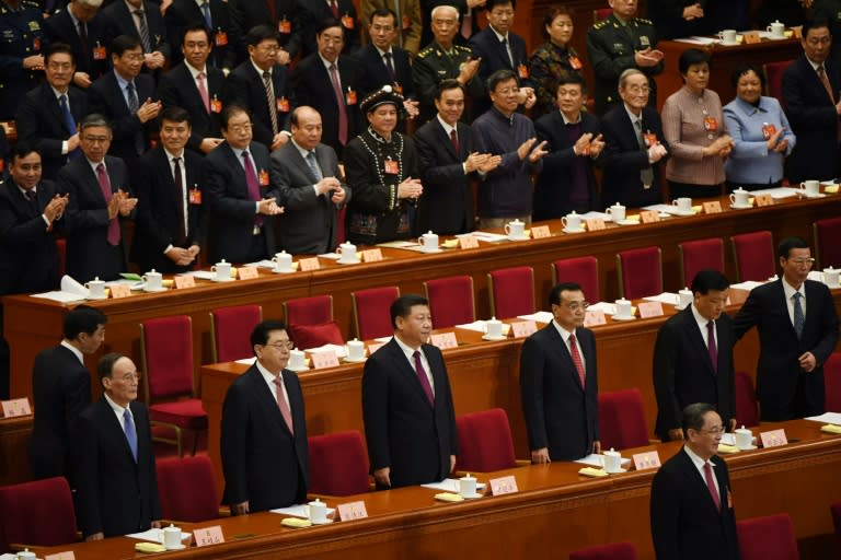 China's ruling Politburo Standing Committee are given a round of applause during the opening session of the Chinese People's Political Consultative Conference (CPPCC) at the Great Hall of the People in Beijing, on March 3, 2017