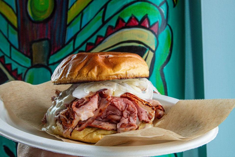Island Pig & Fish opened June 18, 2023, in Fort Pierce, and its menu includes the "C.A.B. Rare Pit Beef Sandwich," served with sweet onions, green chile cheese sauce and horseradish mayo on a griddled potato bun.