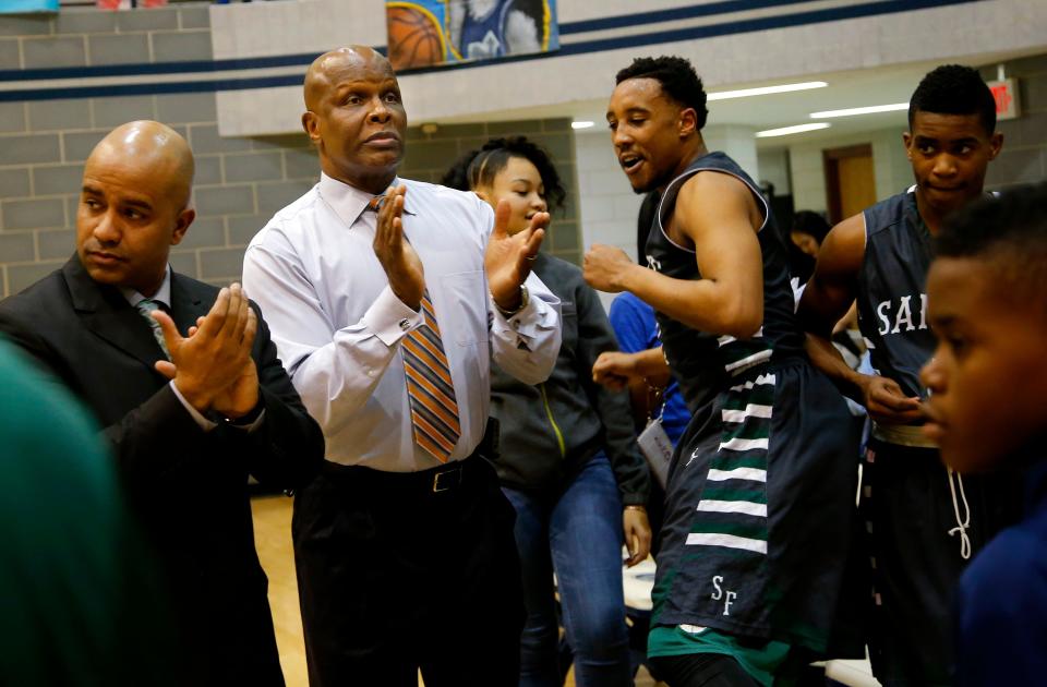 Edmond Santa Fe assistant coach Tommy Griffin claps during introductions for his team before a basketball game against Edmond North at Edmond North High School on Friday, Feb. 20, 2015. Photo by Bryan Terry, The Oklahoman