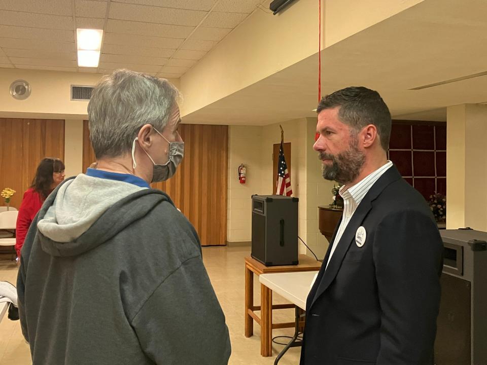 Adam Campbell, right, a candidate for Staunton City Council, talks with a member of the community who attended the Tuesday night candidate forum at Marquis Memorial United Methodist Church.