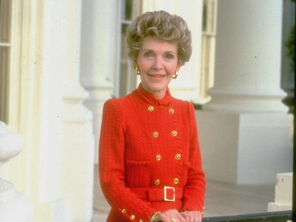 First Lady Nancy Reagan wearing a trademark red dress at the White House.