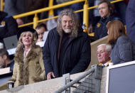 Singer-songwriter and Wolverhampton Wanderers fan Robert Plant smiles during the English Premier League soccer match between Wolverhampton Wanderers and Bournemouth, Wednesday, April 24, 2024, at Molineux in Wolverhampton, England,. (Joe Giddens/PA via AP)