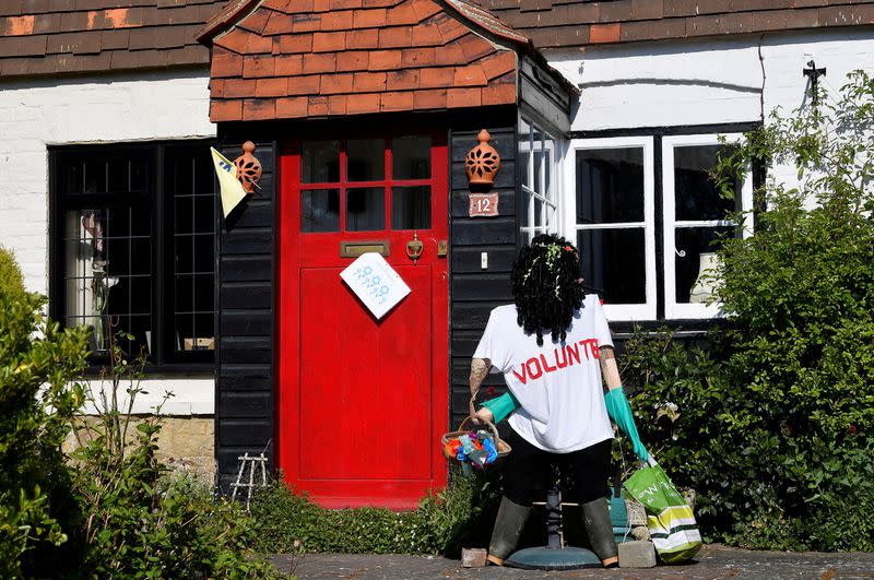 Scarecrows representing key workers lighten the daily lockdown walk, as the number of the coronavirus disease cases (COVID-19) grows around the world, in the village of Capel