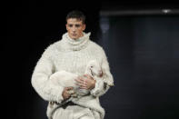 A model wears a creation as part of the Dolce & Gabbana men's Fall-Winter 2020/21 collection, that was presented in Milan, Italy, Saturday, Jan. 11, 2020. (AP Photo/Antonio Calanni)