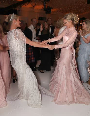 <p>Todd Williamson/Peacock/NBCU Photo Bank/Getty</p> Paris and Nicky Hilton at Paris’ 2021 wedding.