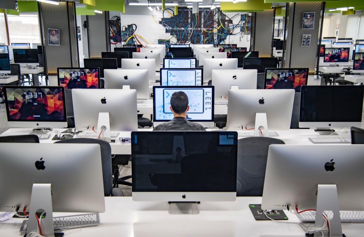 A student, mask-clad due to the COVID-19 coronavirus pandemic, uses a computer at a lab room at the "1337" information technology training centre in Morocco's central city of Khouribga on November 17, 2020. - With its rows of sleek computers and ultra-modern study methods, Morocco's 1337 campus is a dream come true for budding geeks, in a country where IT skills are in high demand. Conceived as a paradise for coders, the centre offers project-based training on programming, innovation and building IT systems. Tuition is free and students largely create their own curricula. (Photo by FADEL SENNA / AFP) (Photo by FADEL SENNA/AFP via Getty Images)