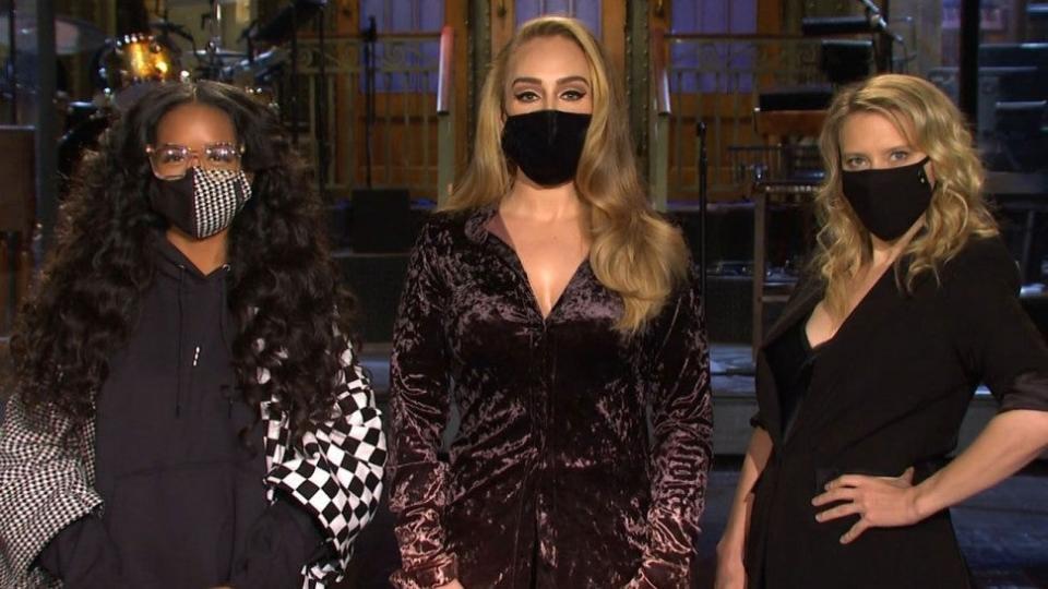 Adele (centre) with singer H.E.R (left) and Kate McKinnonNBC