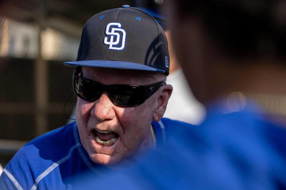 South Dade Head Coach Fred Burnside speaks to player in a huddle during a high school baseball regional semi-final game against West Broward High at Bobcat Field in Pembroke Pines, Florida, on Wednesday, May 10, 2023.